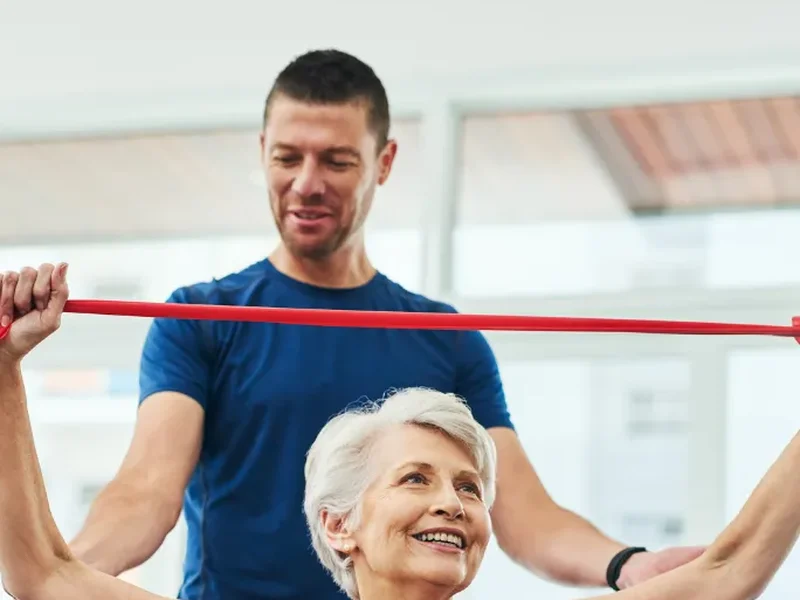 Patient performing progressive strength training under supervision