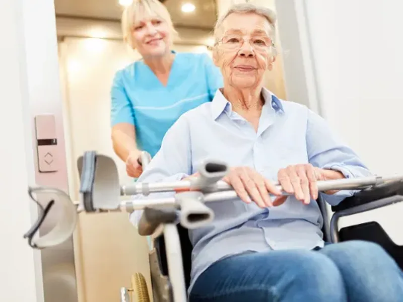 Physical therapist guiding a patient through balance and gait training after a stroke
