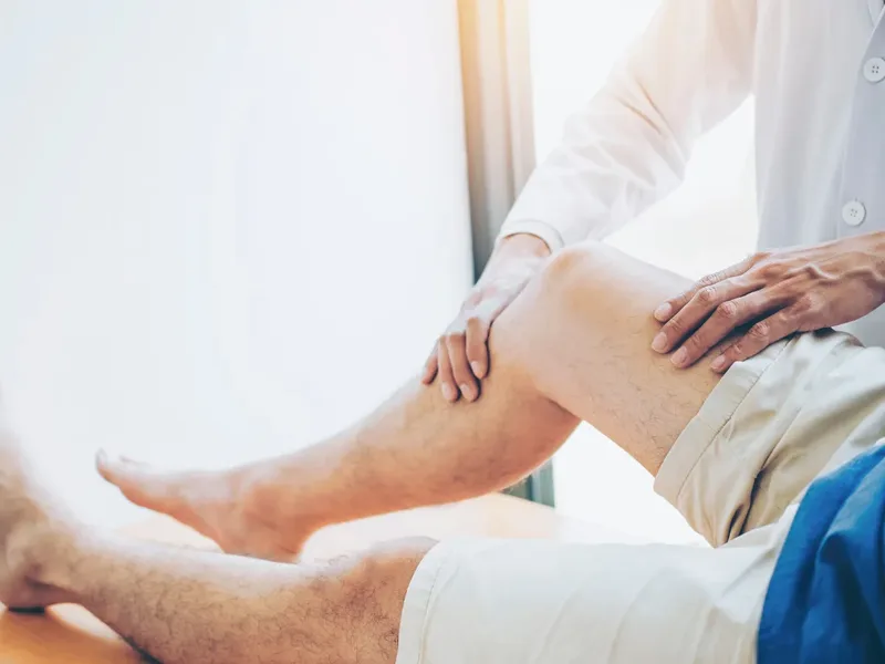 Physical therapist performing Active Release Technique on a patient's forearm