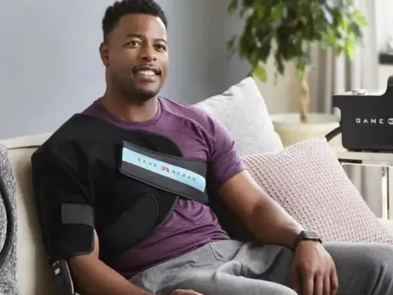 Patient wearing a cold compression therapy wrap on his shoulder