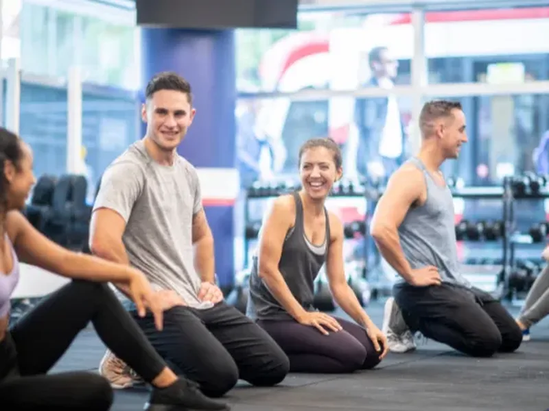 Physical therapist leading an athlete through an injury prevention movement screen