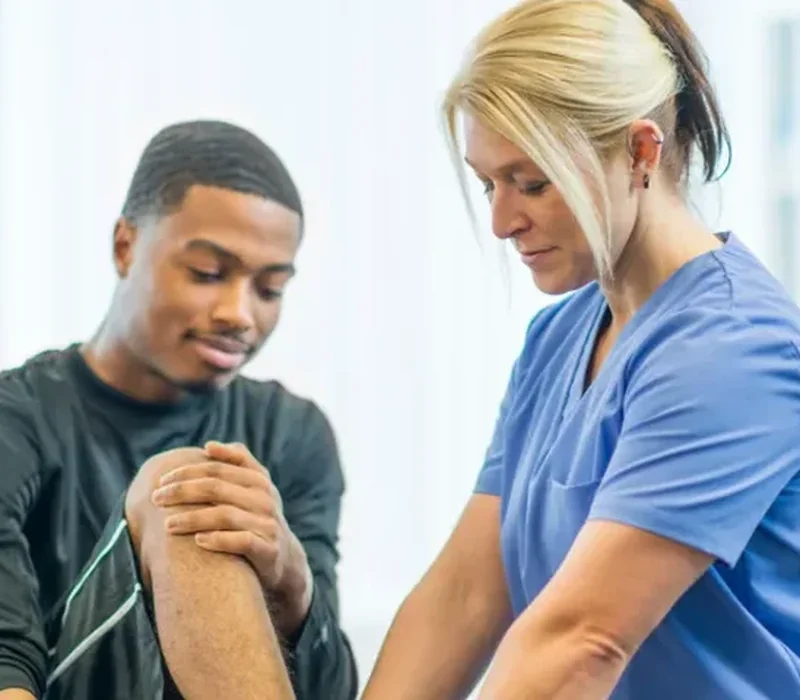 Physical therapist providing hands-on manual therapy