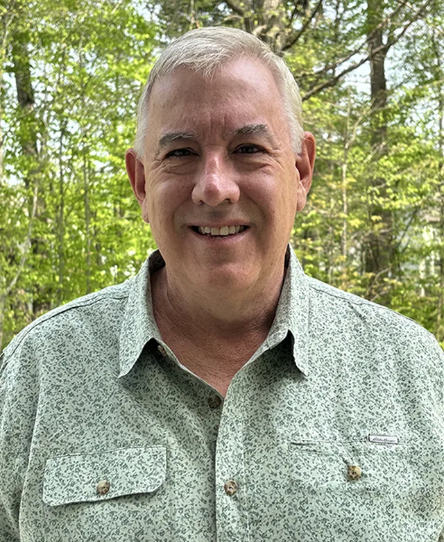 Portrait of Charles S. Mills, III, founder of Mid-County Physical Therapy
